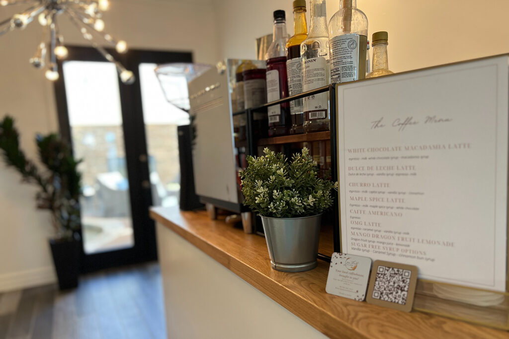 Image of a mobile coffee bar and menu at a corporate event
